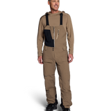Men's mushroom shell bib pants with dark navy panels and adjustable suspenders