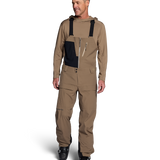 Men's mushroom shell bib pants with dark navy chest panel and adjustable straps