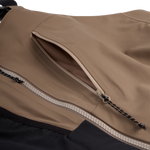 Men's mushroom shell bib pants close-up of chest zipper and pocket trim panel