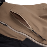 Men's mushroom shell bib pants close-up of chest zipper and pocket trim panel