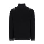Obermeyer Gambel Half Zip Sweater 2025 - A black half-zip sweater with a zippered chest pocket and ribbed cuffs, collar, and hem.