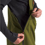 North Face Men's Ceptor Shell Bib - A green waterproof shell bib with a black zipper and orange accents on the side straps.