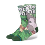 JUNGLE BOOK BY TRAVIS C SK 2023 - A pair of socks featuring a jungle scene with a large gray bear and green leaves.
