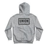 Union Team Hoodie 2026 - A light gray hoodie with a black logo on the chest that reads "UNION" in bold letters, outlined by a thin white border.