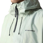 Beyond Medals Anorak 2L Shell Jacket 2024 - A light green jacket with a hood and black zipper.