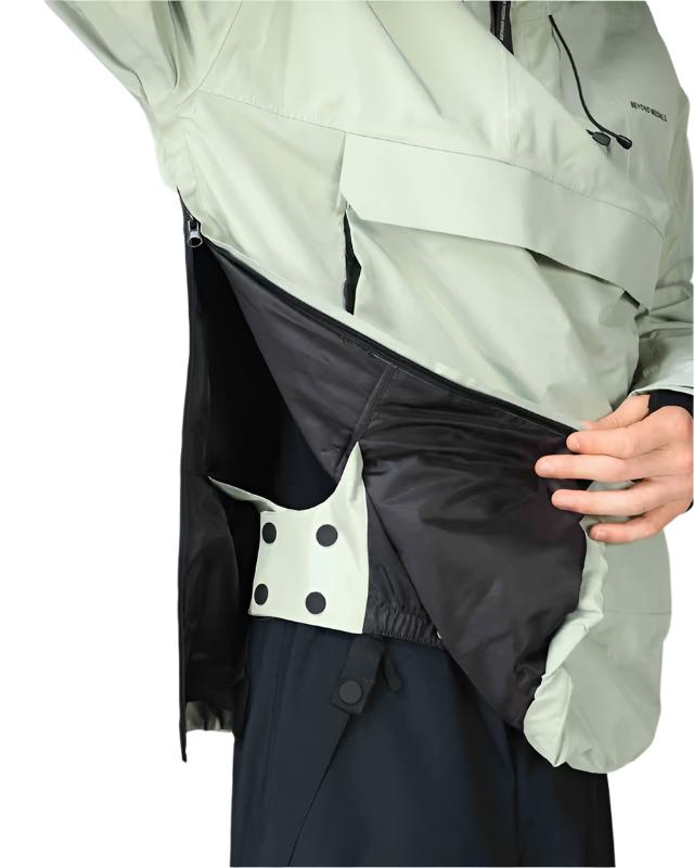 Beyond Medals Anorak 2L Shell Jacket 2024 - A black jacket with a white logo on the left chest and two zippered pockets on either side.
