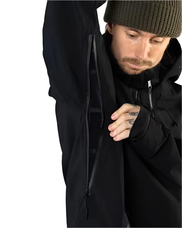 Beyond Medals Tech Shell Jacket 3L 2025 - A black jacket with a zippered chest pocket and adjustable cuffs.