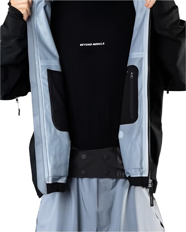 Beyond Medals Tech Shell Jacket 3L 2025 - A black jacket with a white logo on the chest and two zippered pockets on either side.