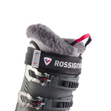 Rossignol Women's Pure Elite 70 Ski Boot 2024 - Black ski boot with white trim and red accents, featuring a gray fuzzy tongue.