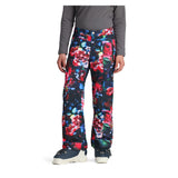 Obermeyer Girl's Brooke Print Pant 2025 - A pair of black snow pants with a colorful abstract floral pattern featuring red, blue, green, and white flowers.