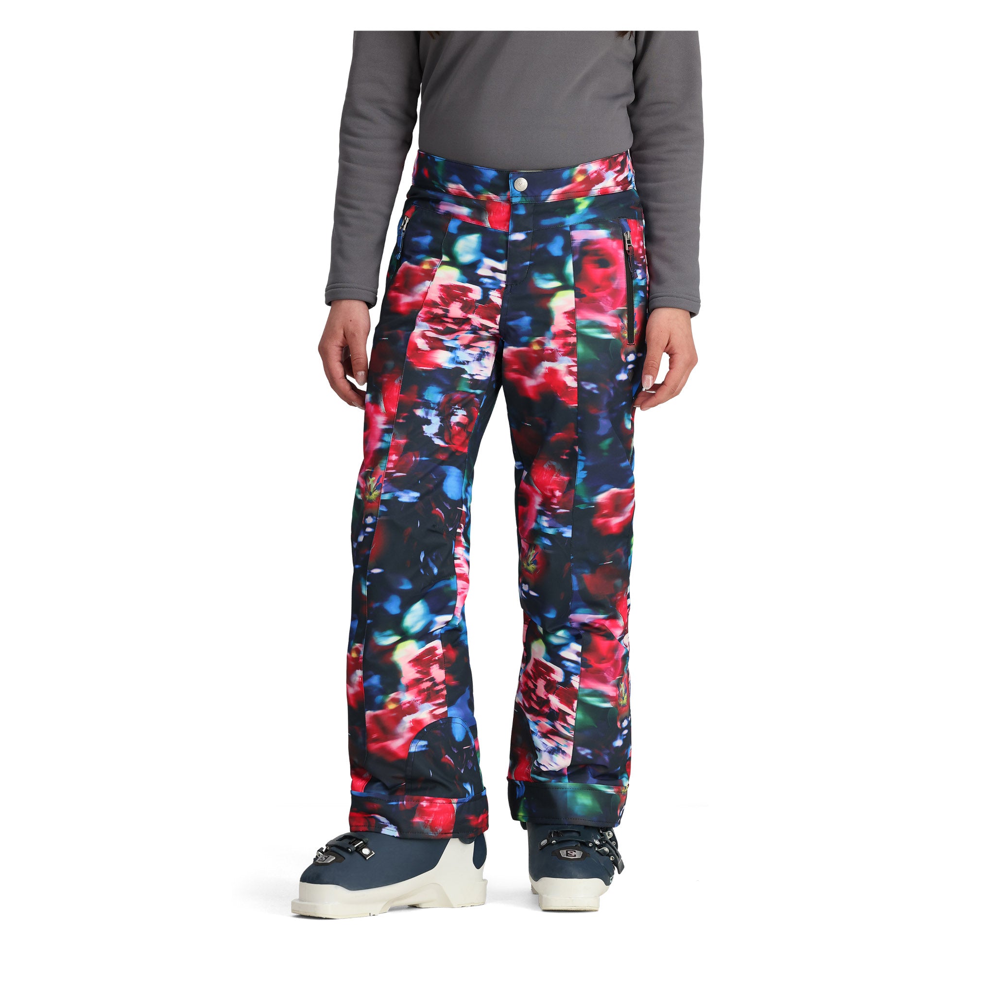 Obermeyer Girl's Brooke Print Pant 2025 - A pair of black snow pants with a colorful abstract floral pattern featuring red, blue, green, and white flowers.