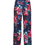 Obermeyer Girl's Brooke Print Pant 2025 - A pair of navy blue snow pants with a colorful floral pattern featuring red, pink, and green flowers.