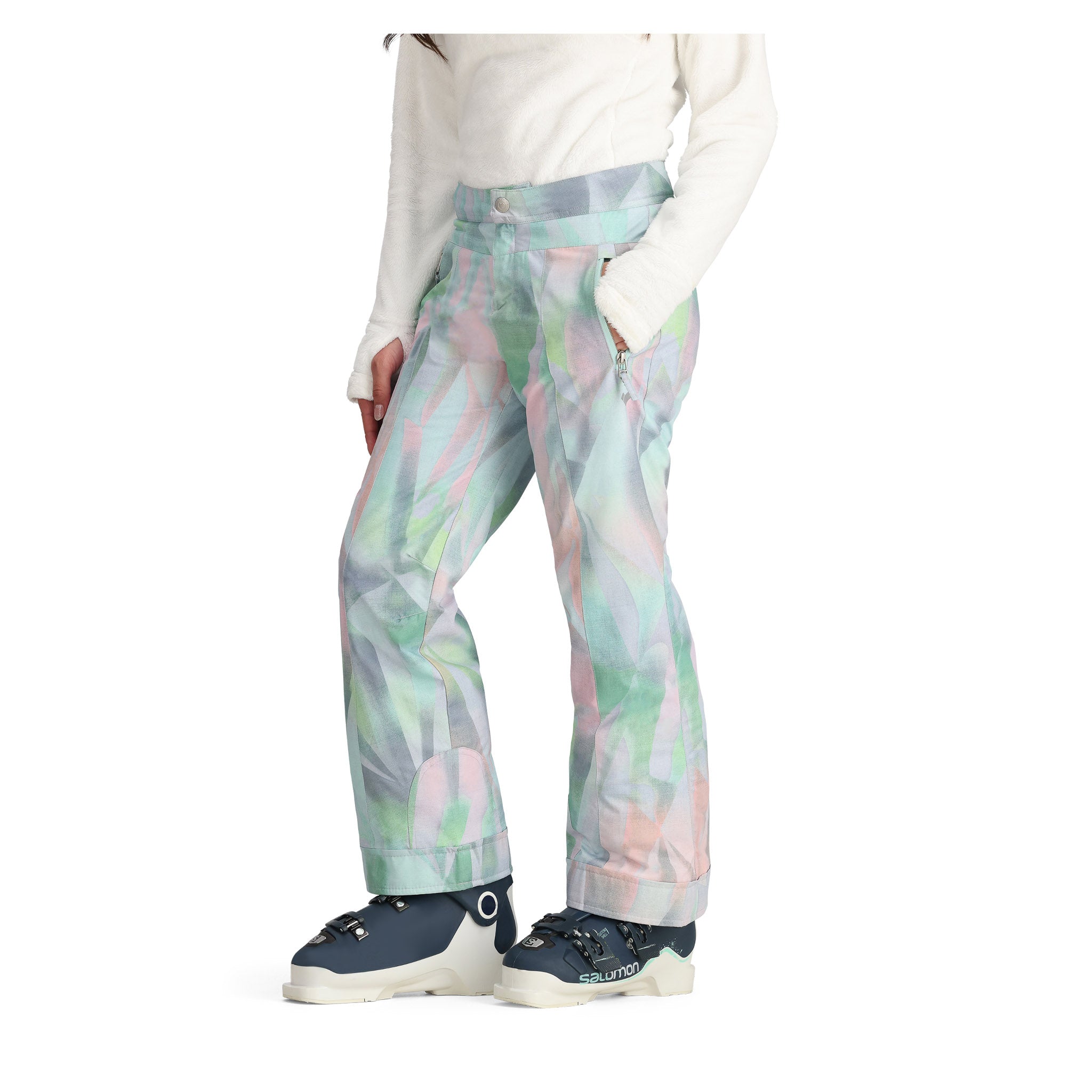 Obermeyer Girl's Brooke Print Pant 2025 - A pair of pastel-colored snow pants with a geometric print in shades of pink, green, and gray.