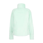 Obermeyer Girl's Furry Fleece Top 2025 - A mint green fleece top with a high collar and long sleeves, featuring a furry texture on the shoulders and upper arms.
