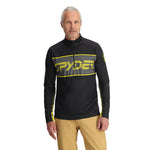 Spyder Men's Paramount 1/2 Zip Top - A black zip-up top with a yellow and grey logo on the chest, featuring a high collar and long sleeves.