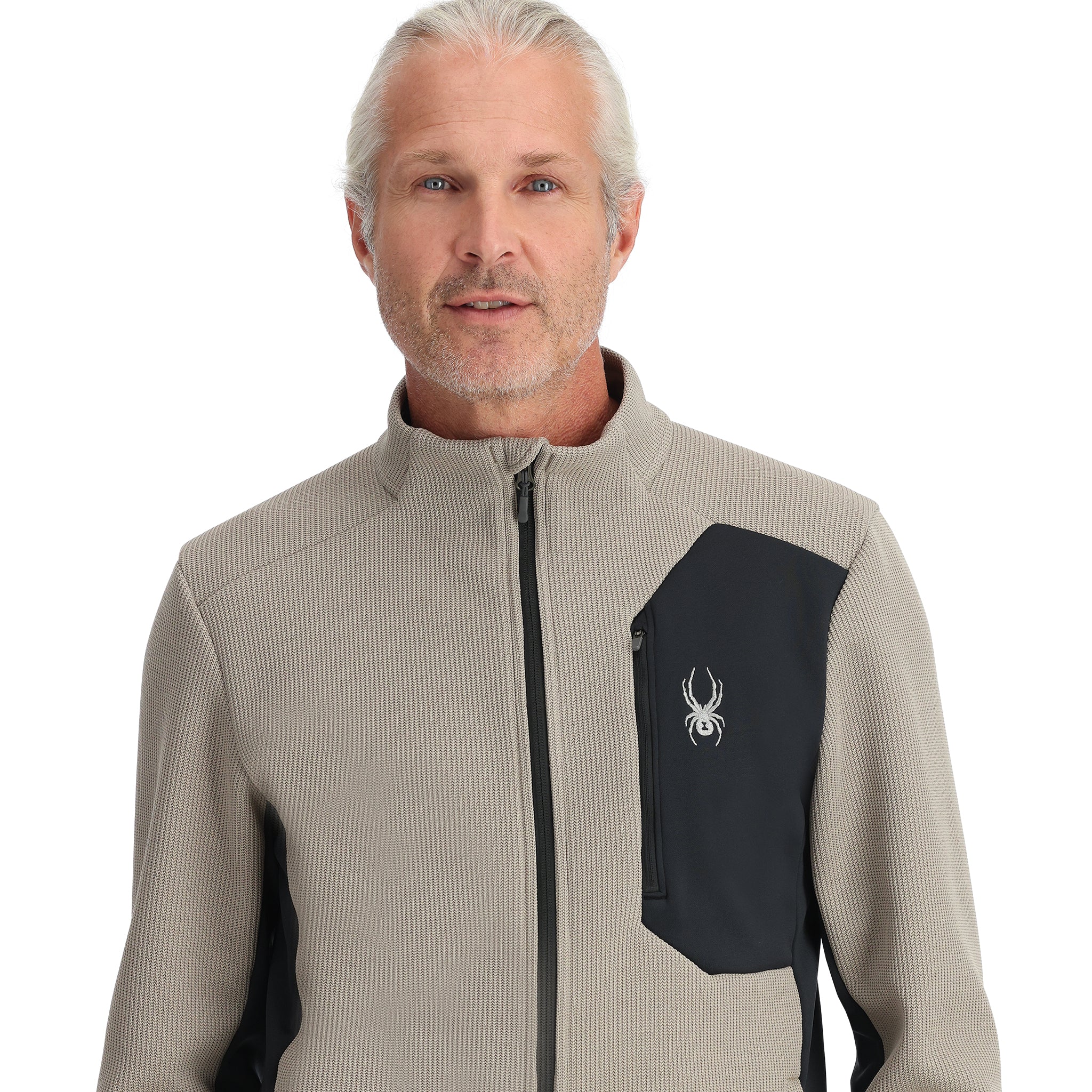 Spyder Men's Bandit Full-Zip Fleece Jacket 2025 - A tan fleece jacket with a black zipper and white logo on the left chest.