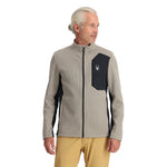Spyder Men's Bandit Full-Zip Fleece Jacket - A black fleece jacket with a zippered front and two side pockets, featuring a white logo on the left chest.