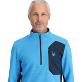 Spyder Men's Bandit 1/2 Zip Top - A light blue top with a black zipper and logo on the left chest.
