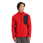 Spyder Men's Bandit 1/2 Zip Top - A red and black half-zip top with a zippered chest pocket featuring a spider logo in red.