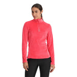 Spyder Women's Shimmer Bug 1/2 Zip Fleece 2025 - A woman wearing a pink fleece top with a zipper and a logo on the chest.