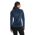 Spyder Women's Shimmer Bug 1/2 Zip Fleece 2025 - A woman wearing a blue fleece top with a shimmer pattern and zippered front.
