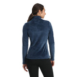 Spyder Women's Shimmer Bug 1/2 Zip Fleece 2025 - A woman wearing a blue fleece top with a shimmer pattern and zippered front.