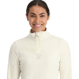Spyder Women's Shimmer Bug 1/2 Zip Fleece 2025 - A cream-colored fleece with a shimmering pattern of bugs embroidered on the chest.