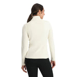 Spyder Women's Shimmer Bug 1/2 Zip Fleece 2025 - A woman wearing a white fleece jacket with a zipper and a shimmer pattern on the front.