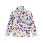Spyder Girls' Reflect 1/2 Zip Top 2025 - A white top with a colorful abstract pattern of red, blue, green, and yellow shapes.