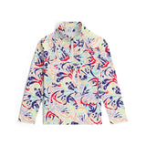 Spyder Girls' Reflect 1/2 Zip Top 2025 - A white top with a colorful abstract pattern of red, blue, green, and yellow shapes.
