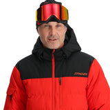 Spyder Bromont Insulated Jacket 2025 - A black jacket with a white logo on the left chest and a red zipper pull.