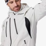 Light grey Spyder insulated jacket with hood, front zip, chest pockets, and side vent panel.