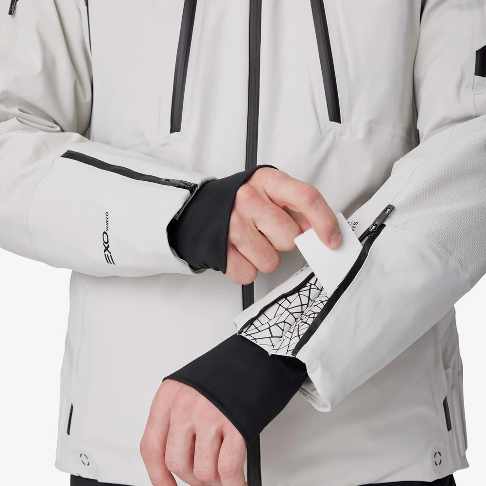 Light grey insulated jacket with black cuff panels, front zippers, and utility pocket openings.