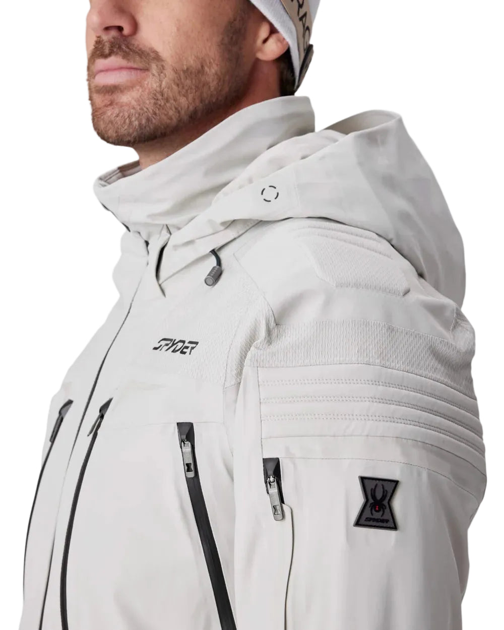 Light grey Spyder insulated jacket with hood, front zip, chest pockets, vented panels.