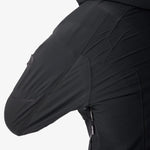 Black insulated jacket sleeve with textured side panel and small zipper detail