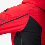Red insulated jacket shoulder and sleeve with black accent panel and zipper seam