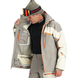 Spyder Leader Insulated Jacket - A man wearing a black shirt with "SPYDER" logo on collar, holding up an open grey and white jacket with orange accents.