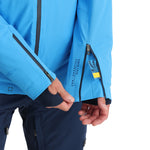 Spyder Pinnacle Insulated Jacket - A bright blue jacket with a black zipper and black trim on the hood, cuffs, and pockets.