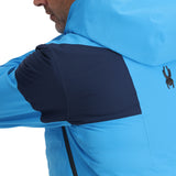 Spyder Pinnacle Insulated Jacket 2025 - A light blue jacket with a black zipper and two zippered pockets on either side.