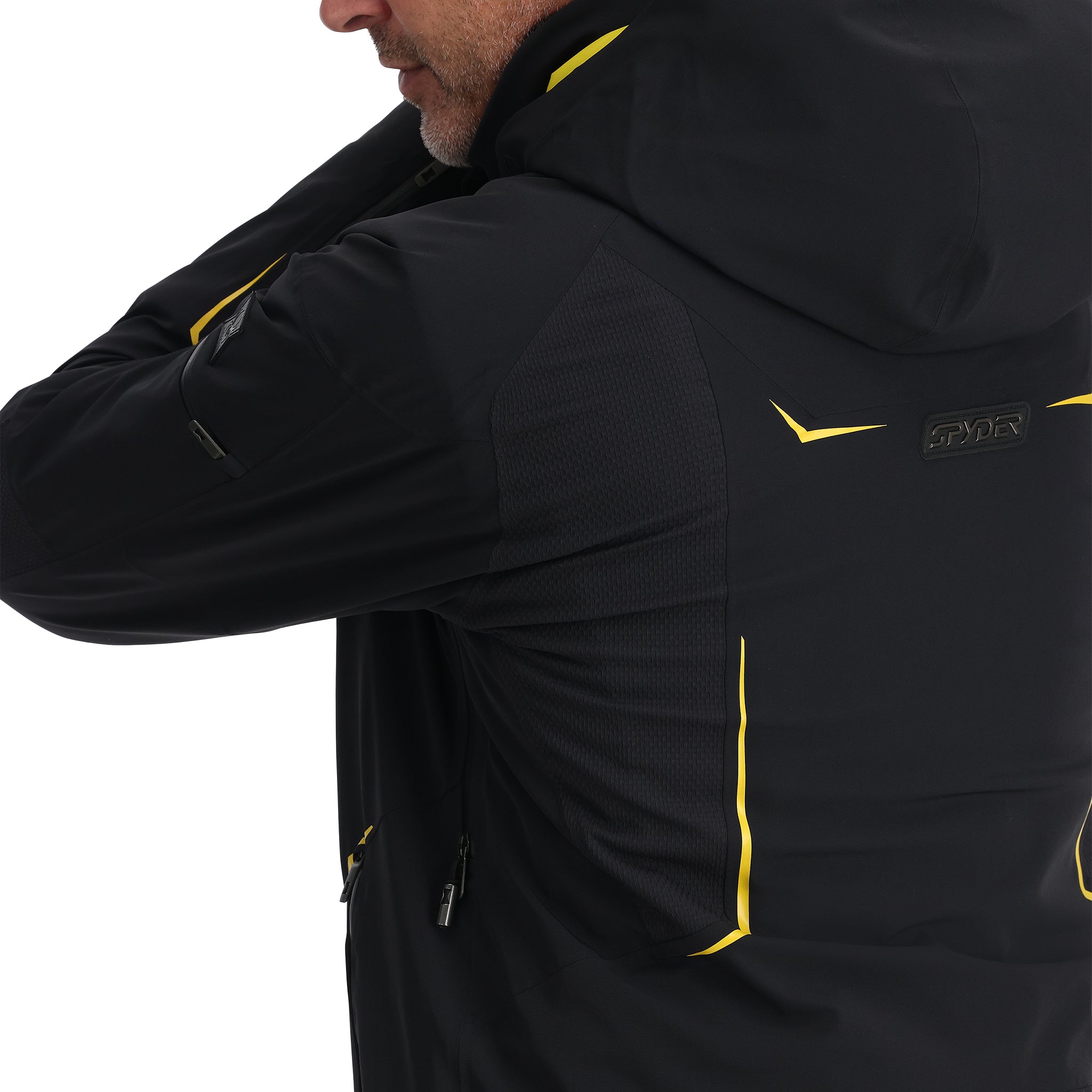 Spyder Monterosa Insulated Jacket - A black jacket with yellow accents on the shoulders and chest, featuring a zippered pocket on the left sleeve.