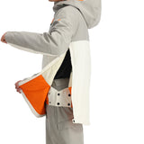 Spyder Men's All Out Insulated Anorak Jacket 2025 - A grey and orange ski jacket with a hood, zippered pockets, and a white trim around the cuffs and hem.