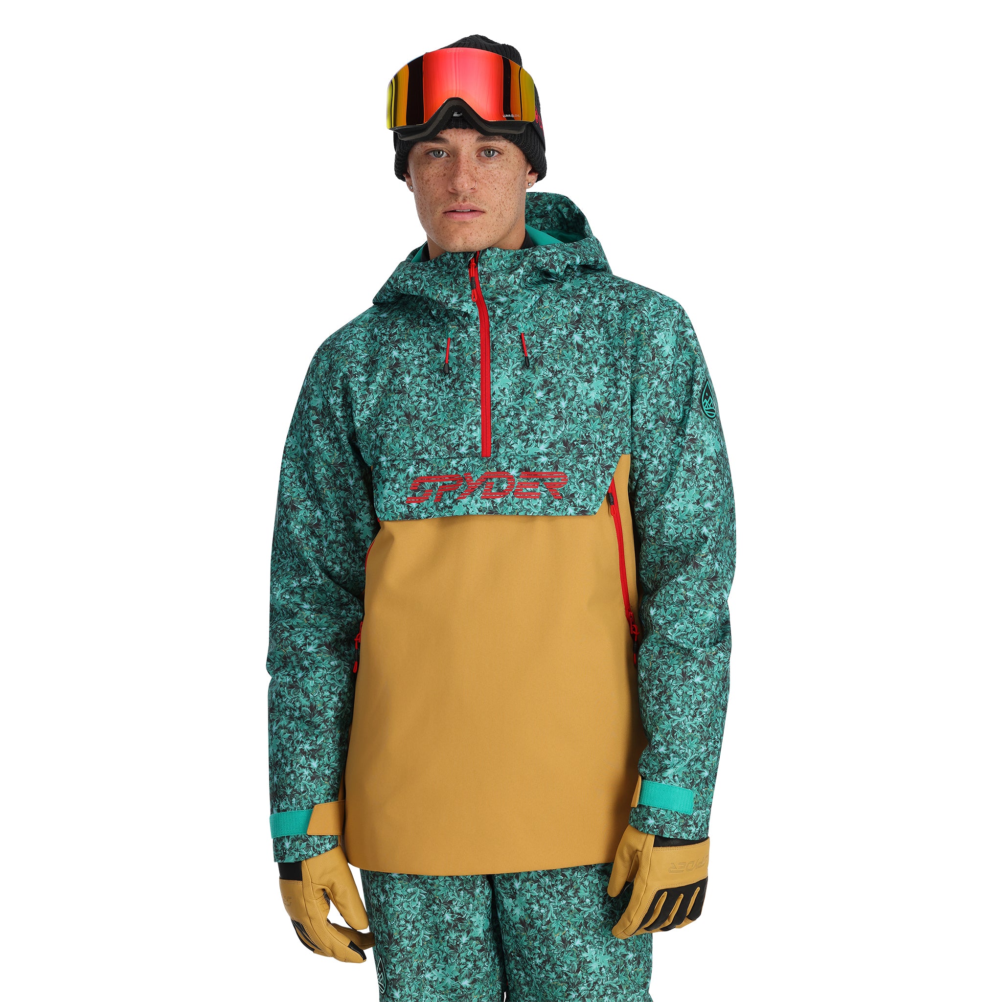 Spyder Men's All Out Insulated Anorak Jacket 2025 - A green and black snowflake patterned jacket with a red zipper, on a model wearing goggles and gloves.