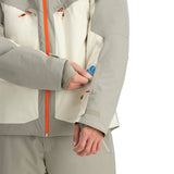 Spyder Copper Insulated Jacket - A woman's hand is adjusting a zipper on the jacket, which has a copper-colored zipper and a black pull tab.