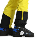 Spyder Men's Boundary Insulated Pants - A pair of black ski pants with a yellow stripe down the side and a zippered pocket on the thigh.