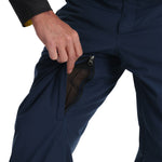 Spyder Men's Boundary Insulated Pants - Dark blue pants with a black zipper and yellow accents on the side pockets.