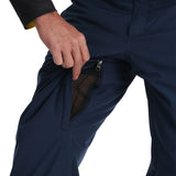 Spyder Men's Boundary Insulated Pants - Dark blue pants with a black zipper and yellow accents on the side pockets.