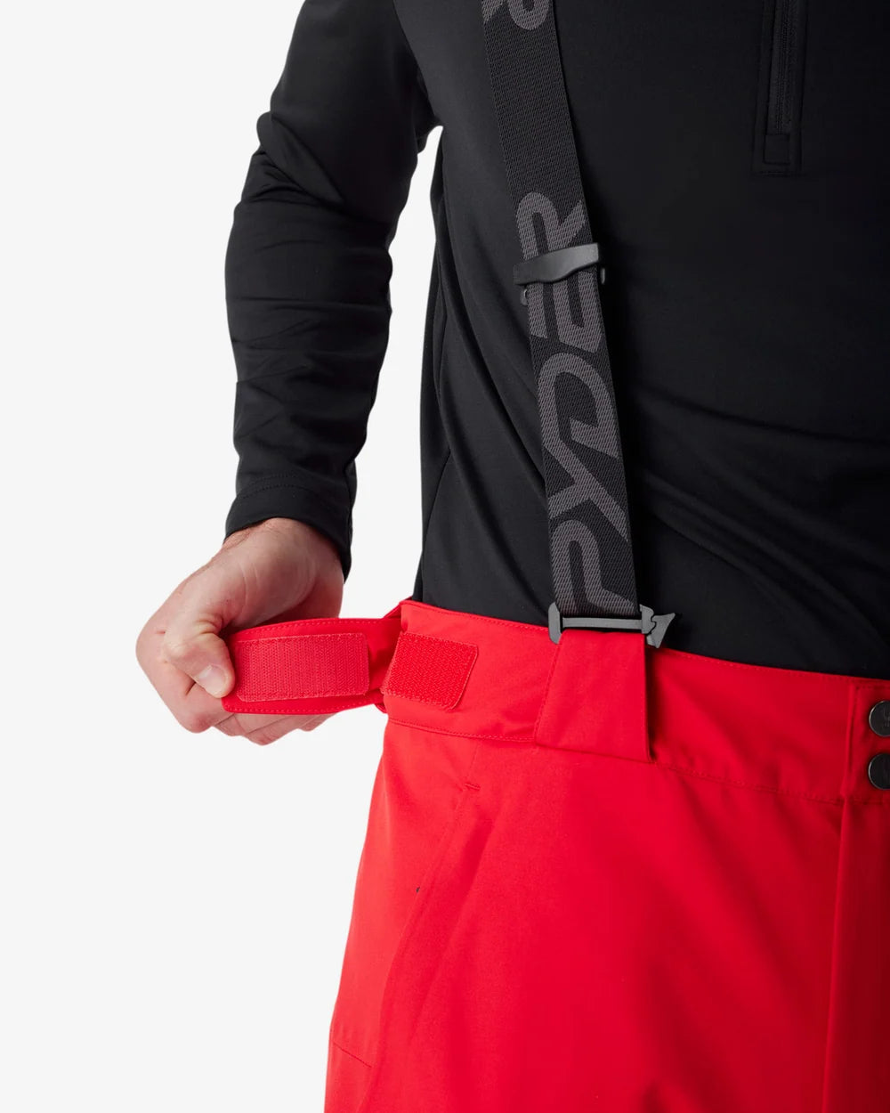 Insulated ski pants front with red belt, black waistband, and button detail