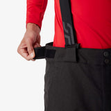 Insulated ski pants waistband detail with adjustable black strap and snap closure