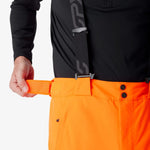 Insulated ski pants close-up: orange waistband with black belt loops and snap button