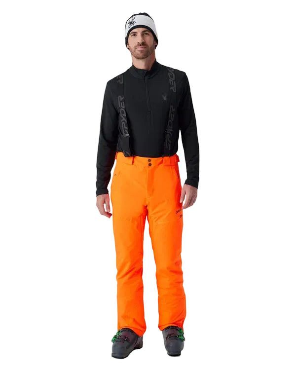 Insulated ski pants in vivid orange with front pockets and black ankle boot cuffs